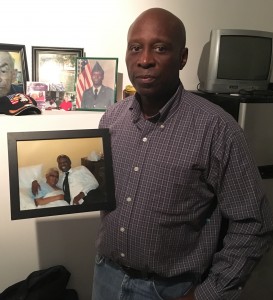 Mangum, in "Walking in an Army Veteran's Shoes" by Carousso, holds a picture of him and his grandmother that was taken months before she died in 2012.